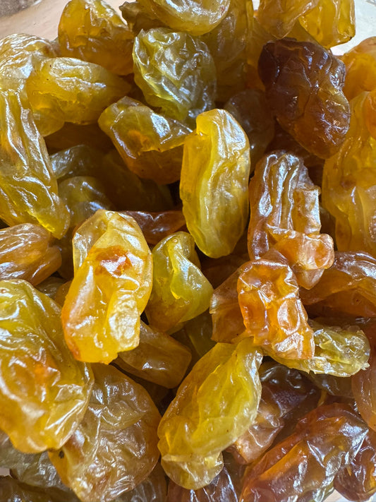 Close-up of dried raisins with a focus on texture and color.