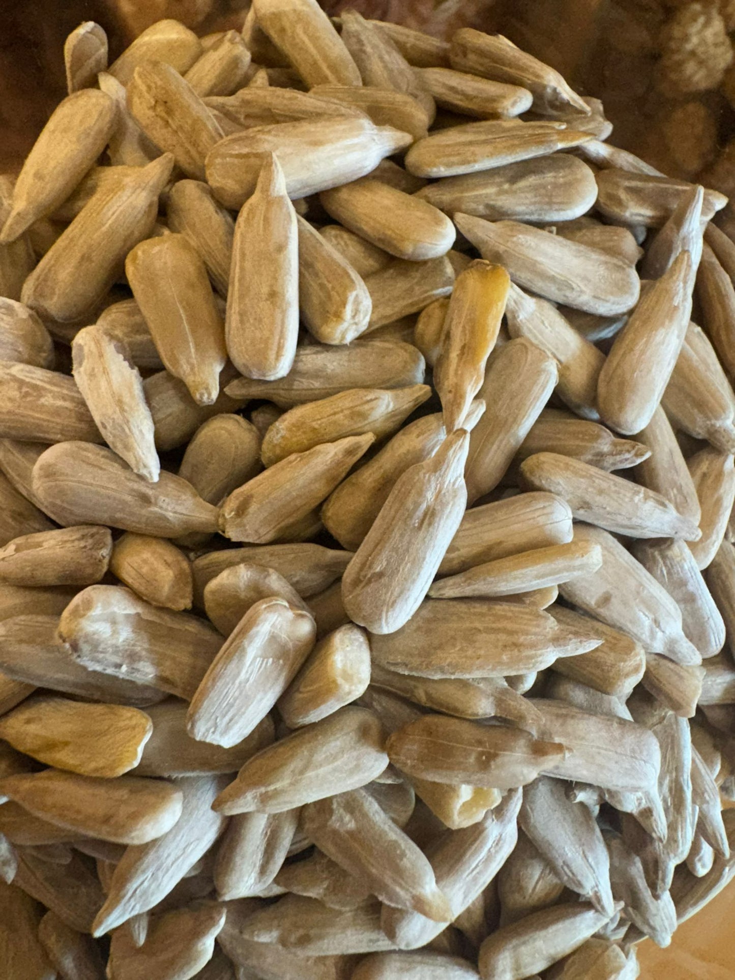 Close-up of sunflower seeds on a wooden surface